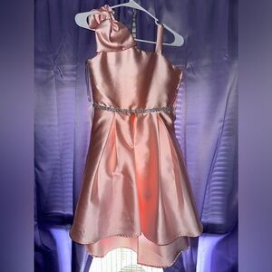 My daughter wore this as a flower girl but sadly does not fit it anymore.